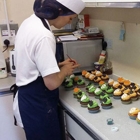 Cake decorating at the bakery of Lewis&rsquo;s Farm Shop